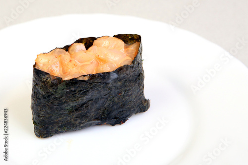 Spice sushi with smoked salmon. In nori seaweed.