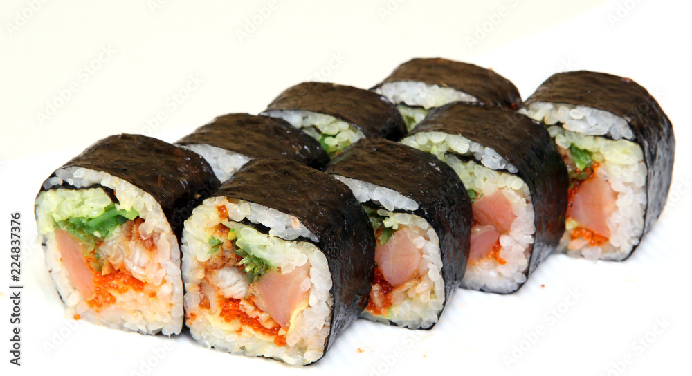 Roll with caviar of salmon. Sushi with caviar of flying fish. Japanese food on a beautiful dish. Roll with caviar of salmon. Sushi with caviar of flying fish. Japanese food on a beautiful dish.