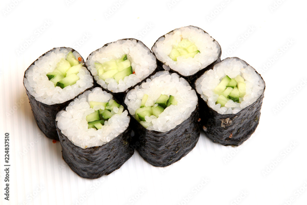 Roll with cucumber. Vegetarian food. Sushi in the nori. Japanese food on a beautiful dish. Roll with cucumber. Vegetarian food. Sushi in the nori. Japanese food on a beautiful dish.