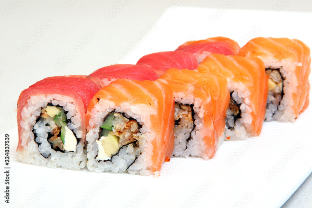 Sushi. Rolls with shrimp. Roll California with avocado. Japanese food. Healthy food is nicely laid out on a platter. Dish with rice. Sushi. Rolls with shrimp. Roll California with avocado. Japanese food. Healthy food is nicely laid out on a platter. Dish with rice.