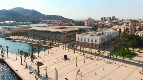 Aerial shot over Cartagena main square, Spain, Summer 2018. Large bronze statue in Cartagena