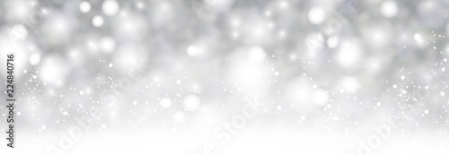 Grey shiny blurred winter banner with snow.