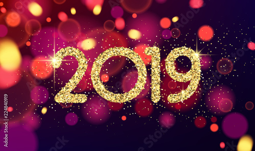 Golden shiny 2019 New Year sign on blurred background.