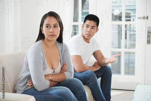 Pretty young woman listening to complaints of her boyfriend