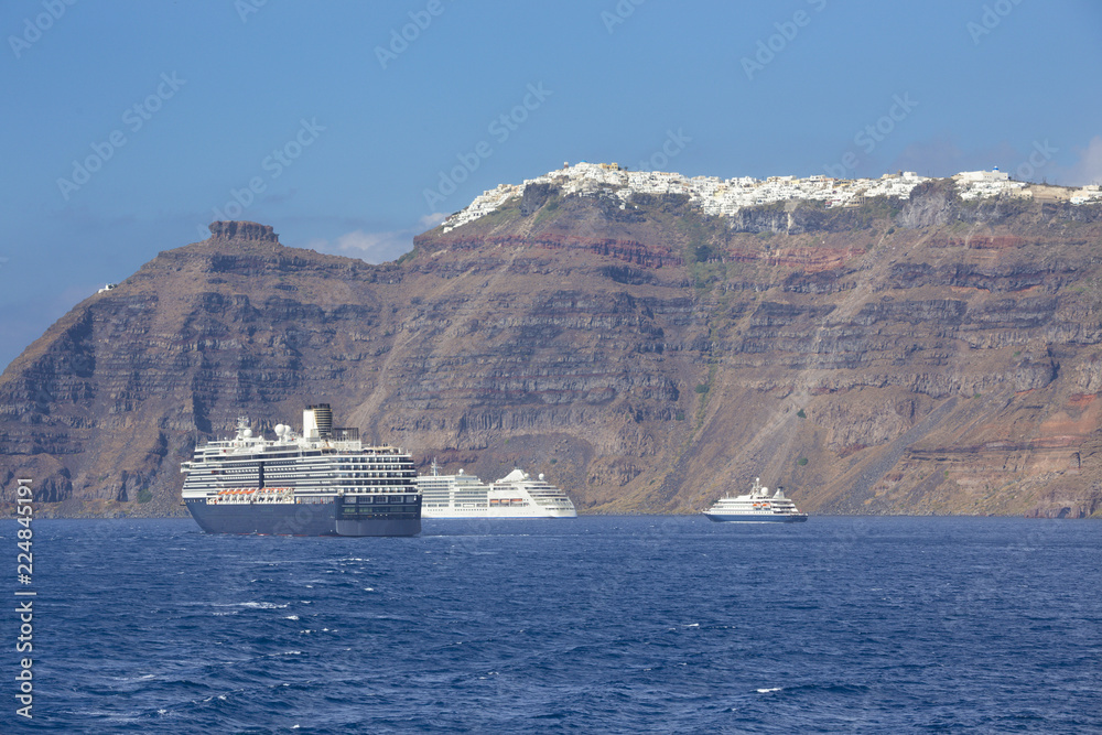 Santorini - The cliffs of calera with the cruises withe the Imerovigli and Skaros in the background.