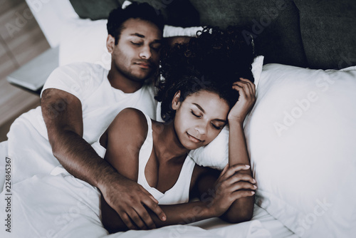 Afro American Couple Are Sleeping In The Bed.
