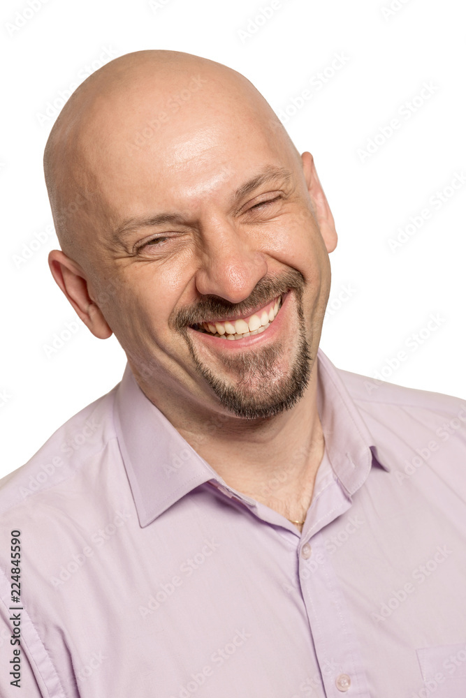 Fototapeta premium Bald friendly man laughing, close-up, isolated on white background