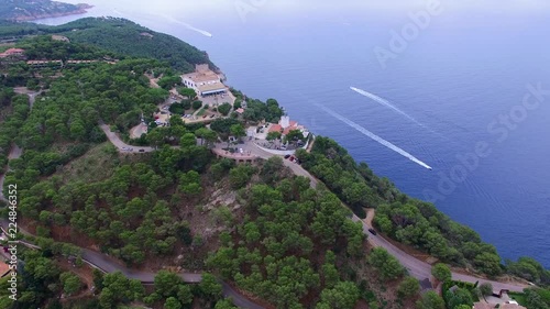 Aerial shot over the lighthouse on the cape Far de Sant Sebastia, Llafranc, Palafrugell, Costa Brava, Catalonia, Spain