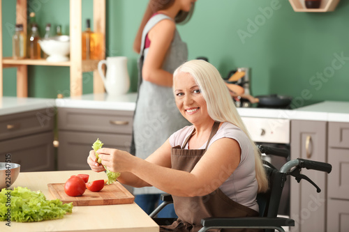 Mature woman in wheelchair ...