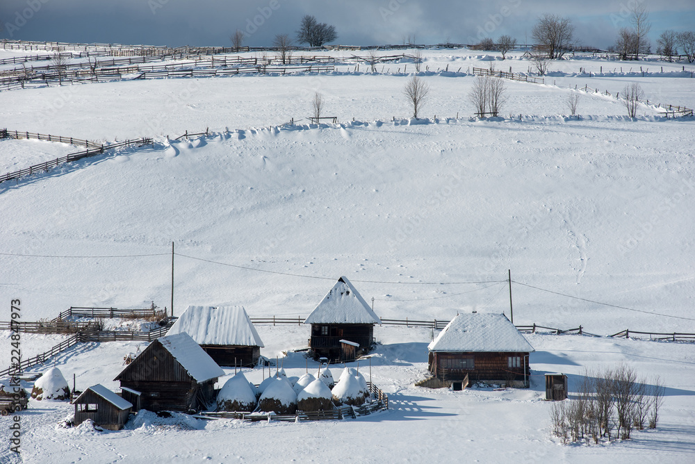 Alpine village in winter in Transylvania