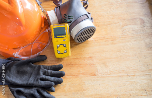 Standard personal protective equipment on wooden table. top view, concept safety 