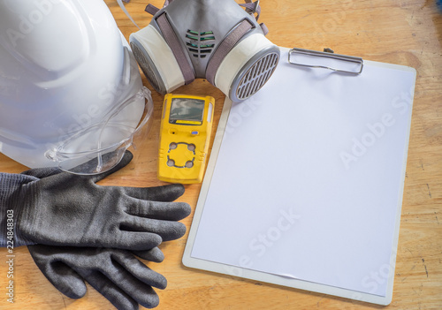 Standard personal protective equipment on wooden table. top view, concept safety 
