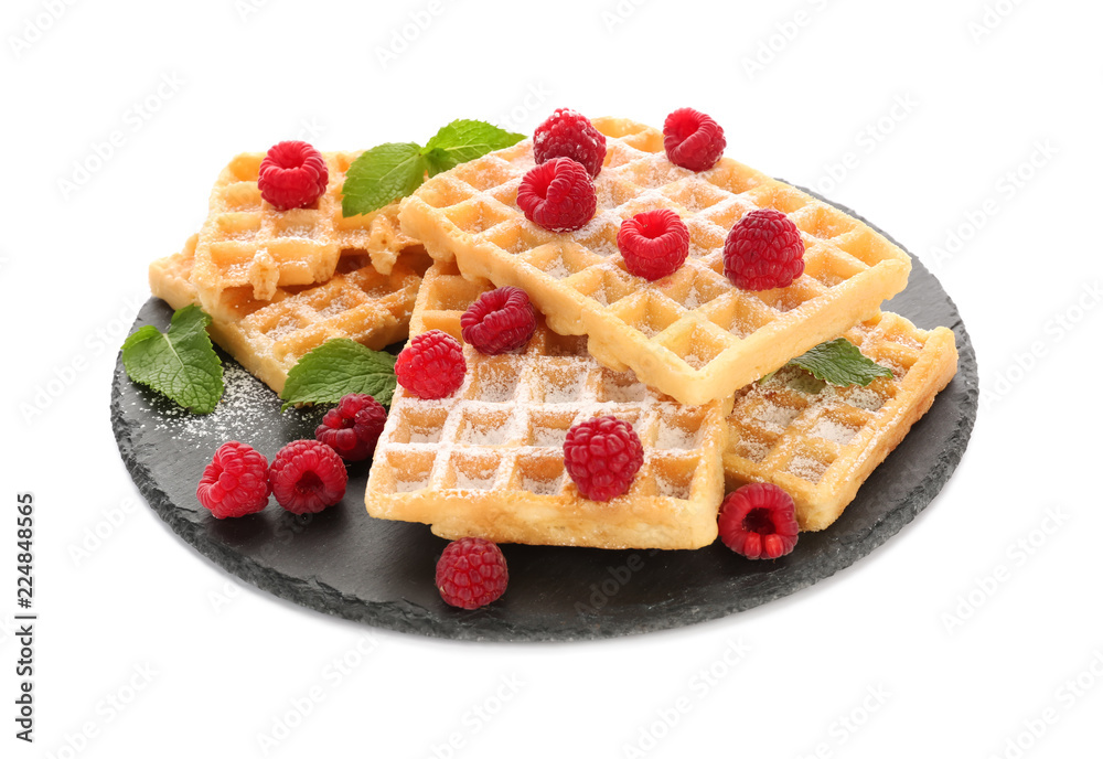 Slate plate with delicious waffles and raspberries on white background Slate plate with delicious waffles and raspberries on white background