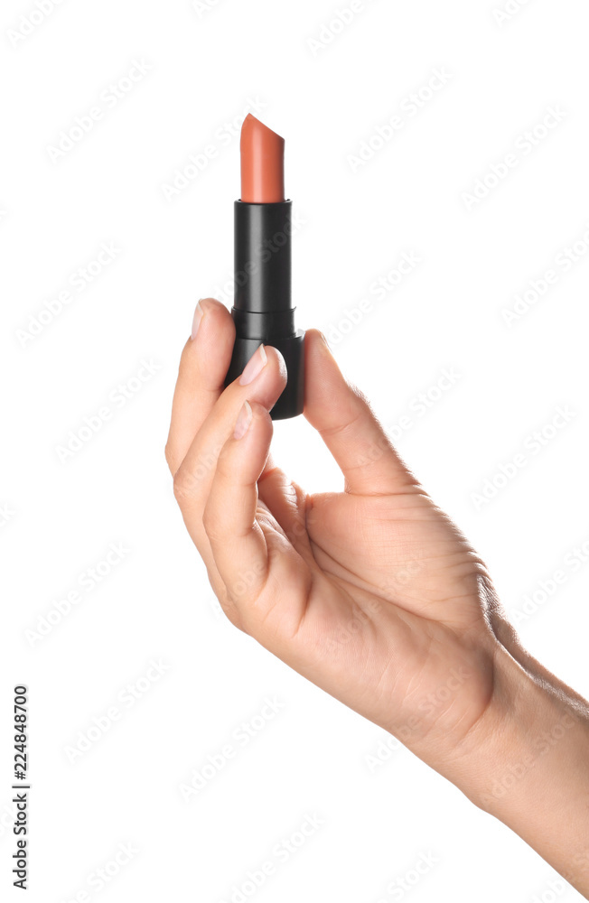 Woman holding color lipstick on white background