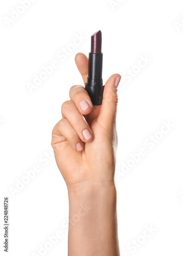 Woman holding dark color lipstick on white background
