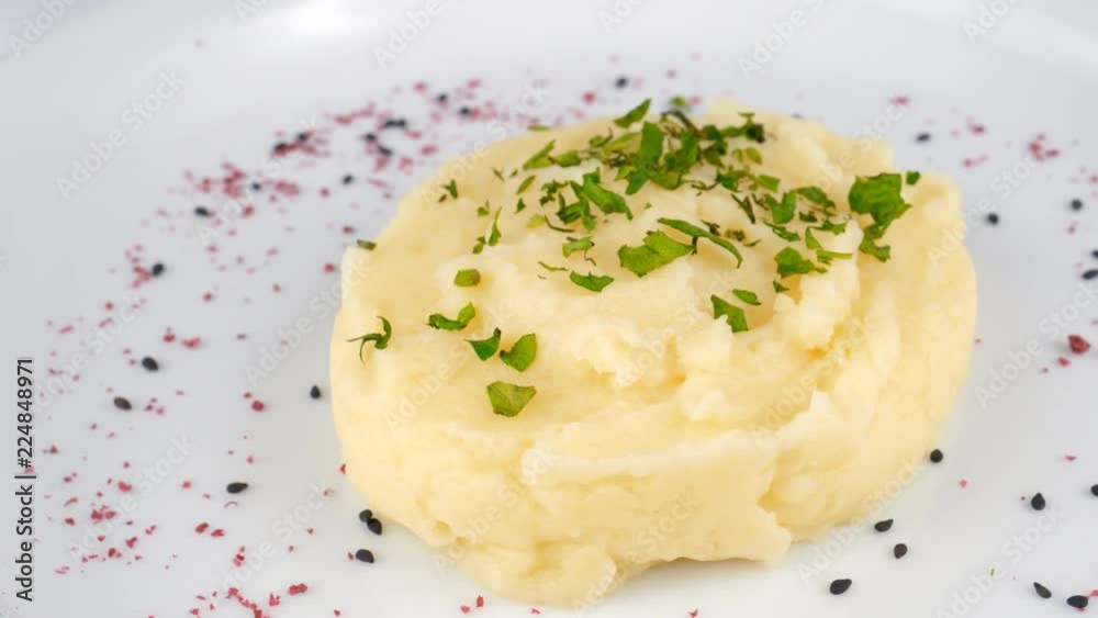 Potato mash with parsley on top, served in Restaurant, loop Potato mash with parsley on top, served in Restaurant, loop