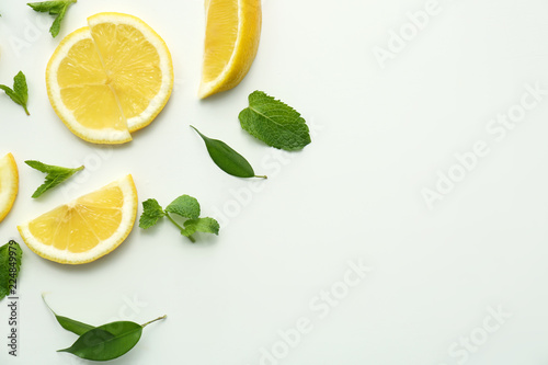 Flat lay composition with lemon slices on white background