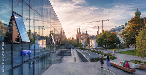 Moscow. September 20, 2018. The Zaryadye Park. Varvarka Street. The Pokrovskiy cathedral, the Varvarinskaya Church, the old English courtyard and the glass facade of the house 6, Building 1