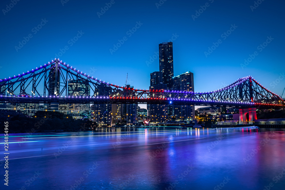 Bright glowing bridge in cityscape