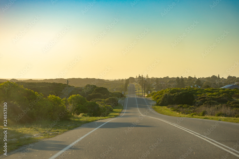 Road trip at sunset horizon