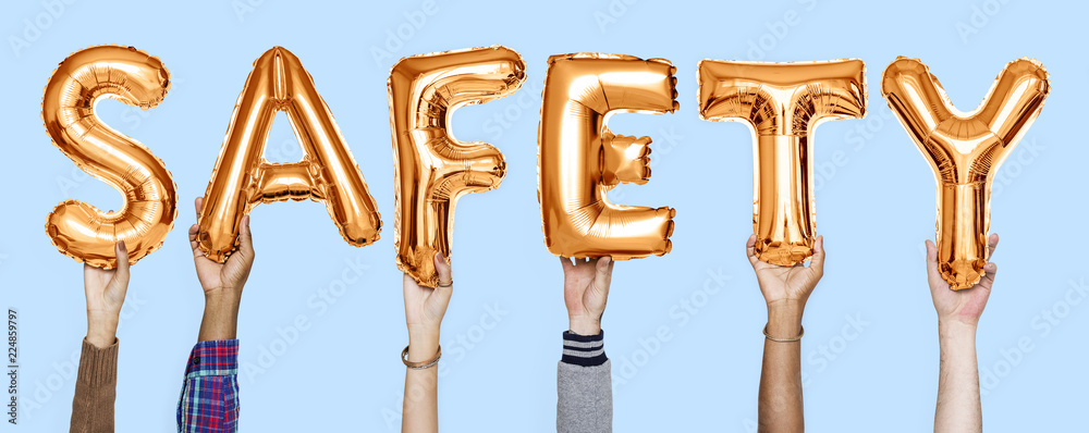 Orange alphabet balloons forming the word safety Orange alphabet balloons forming the word safety