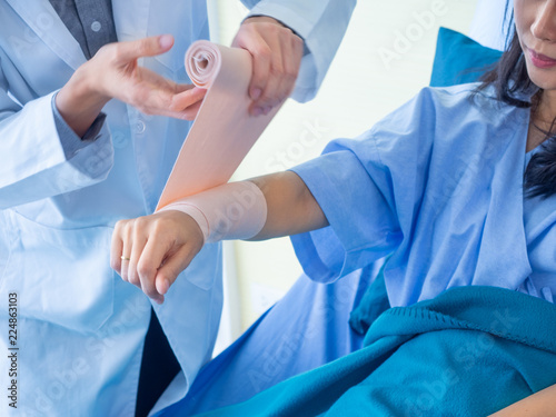 close up the doctor wounds the patient.