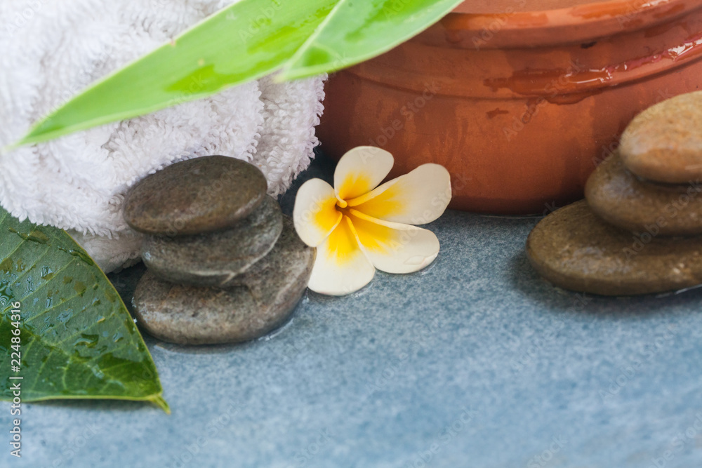 tropical spa objects for massage with sunlight on blue table background. tropical spa objects for massage with sunlight on blue table background.