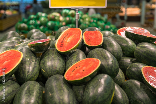 Fresh healthy fruits on shelves in supermarket