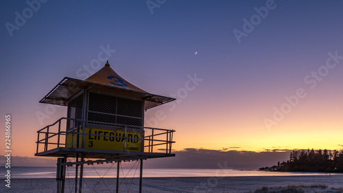 Lifeguard tower on beach against pre dawn sky © jmimages