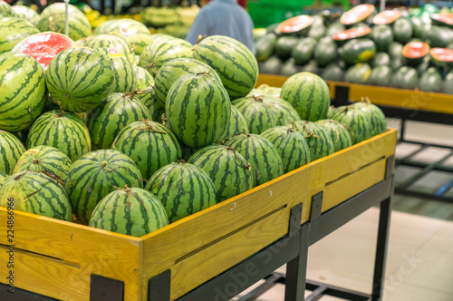 Fresh healthy fruits on shelves in supermarket