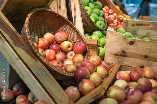 Fresh healthy fruits on shelves in supermarket