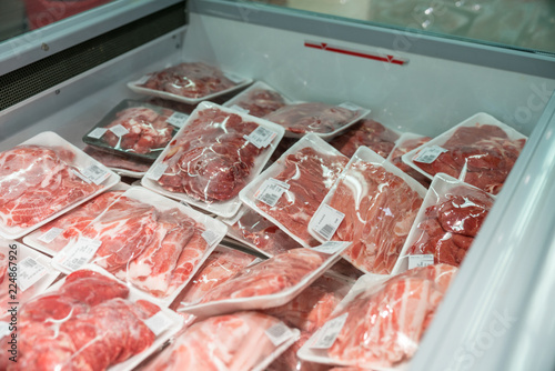 Raw meat in plastic box in supermarket