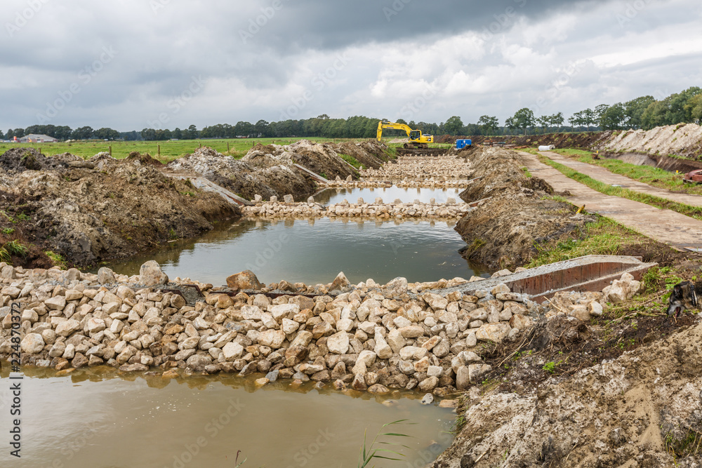 Rolderdiep, Anderen, Drenthe, Netherlands, August 30, 2014: Construction of a fish ladder in the  Rolderdiep near the village of Rolde in Dutch province of Drenthe replaces of Weirs and locks
