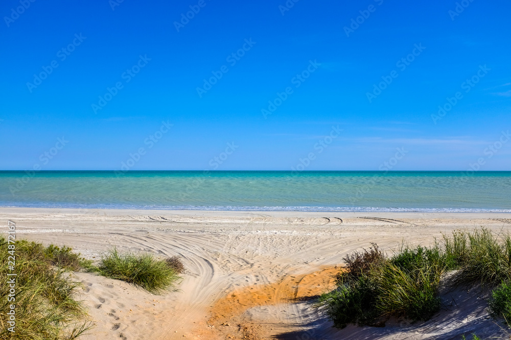 Clear blue sky over ocean and beach