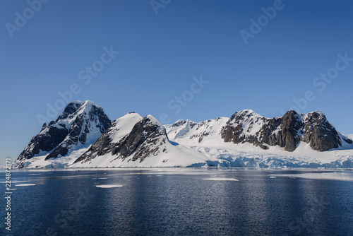 Antarctic landscape with mountains and reflection © Alexey Seafarer
