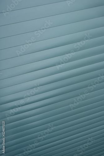 Striped diagonal grey texture, abstract background