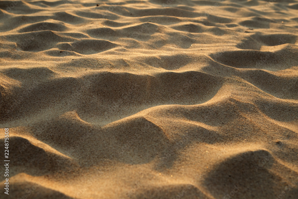 Fototapeta premium closeup of sand pattern of a beach in the summer