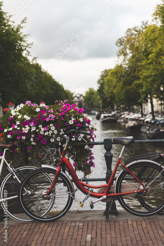 Bicycles lining a bridge over the canals of Amsterdam, Netherlands