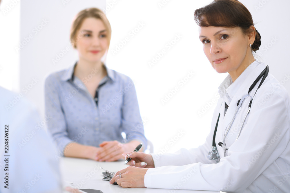 Doctor and patient at meeting. Medicine and health care concept Doctor and patient at meeting. Medicine and health care concept