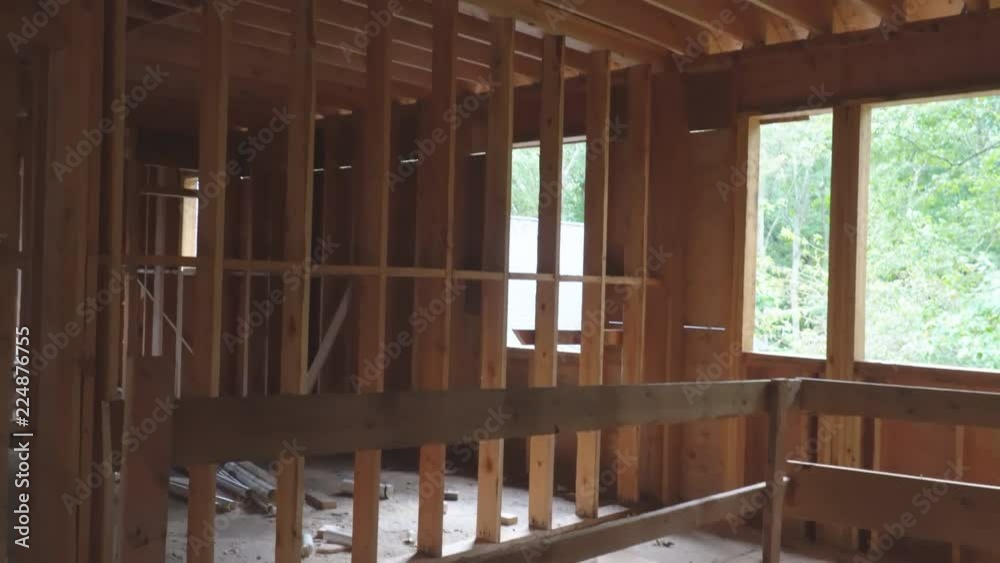 unfinished wood frame building or a house under construction unfinished wood frame building or a house under construction