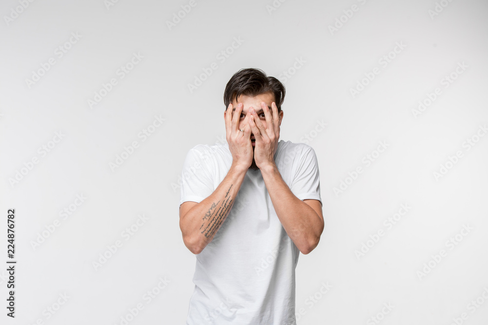 I'm afraid. Fright. Portrait of the scared man. Business man standing isolated on white studio background. male half-length portrait. Human emotions, facial expression concept. Front view I'm afraid. Fright. Portrait of the scared man. Business man standing isolated on white studio background. male half-length portrait. Human emotions, facial expression concept. Front view