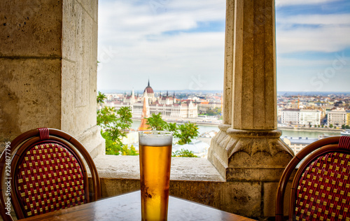 Enjoying a beer in Budapest overlooking the Danube and Parliament buildings