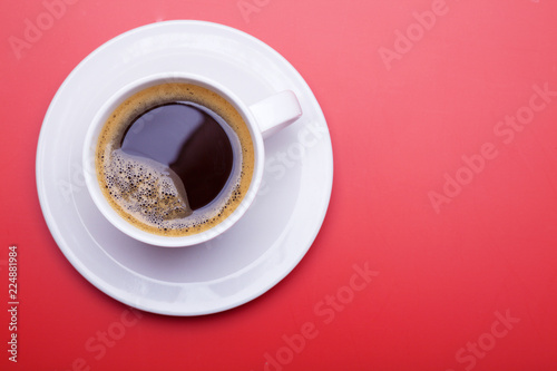 Cup of black coffee on table top view, flat lay, mock up. Cup of Black Coffee in White Ceramic Cup on plastic Tabletop