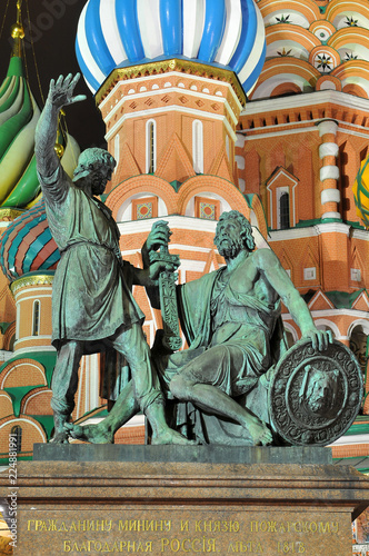 Statue of Kuzma Minin and Dmitry Pozharsky in front of St. Basil Cathedral on Red Square in Moscow. photo