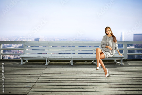 Slim young woman in city and free space for your decoration. 