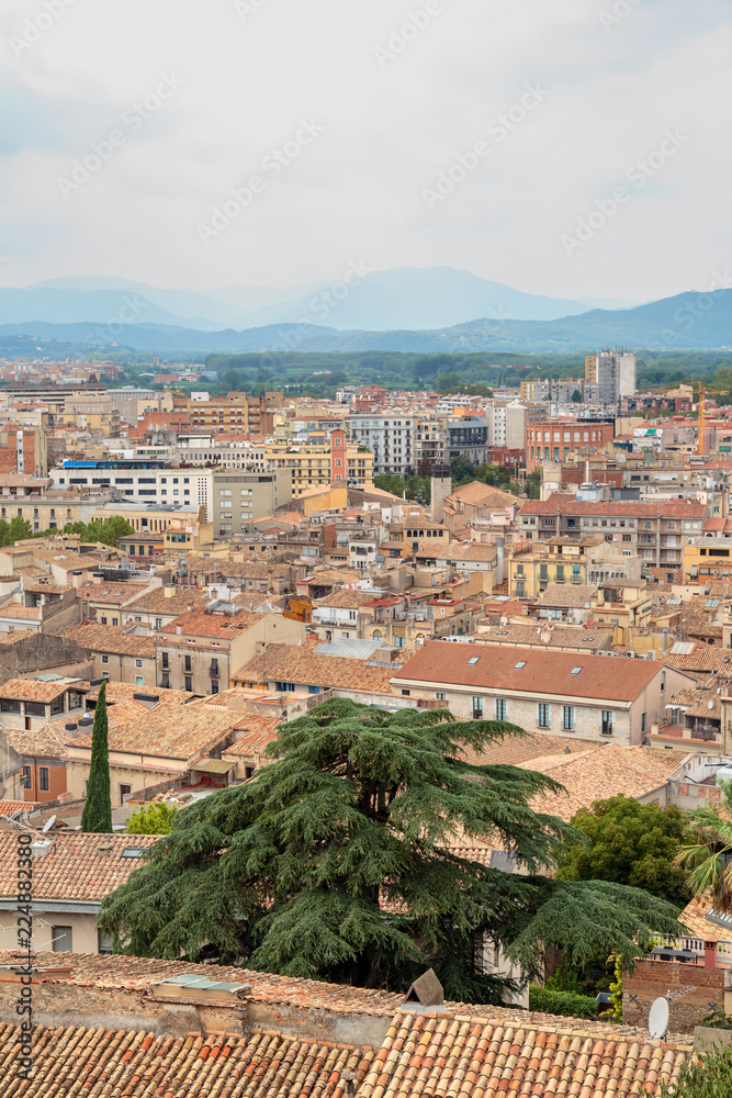 roofs of Girona on the background of the mountains