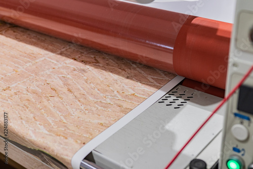Fotografie Big red laminator, printing machinery for press and advertising.