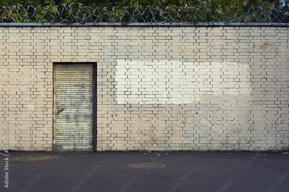 Obraz premium door in brick wall