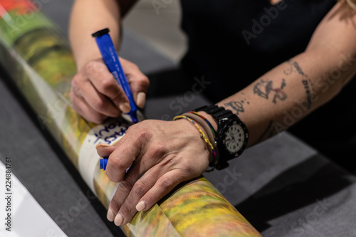 Fotografi Ex convincts' redemption chance in a professional  printing facility, big vinyl rolls, ready for large printer supply