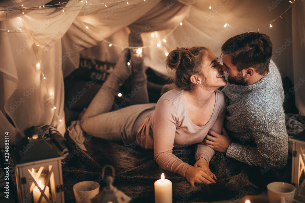 Couple on bed together in romantic mood - obrazy, fototapety, plakaty 